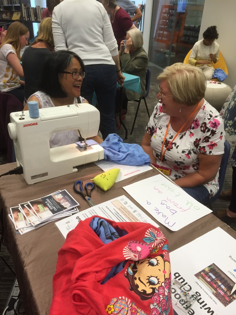 Jan having fun chatting to a lady about sewing