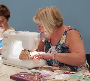 Jan sewing in the piping workshop